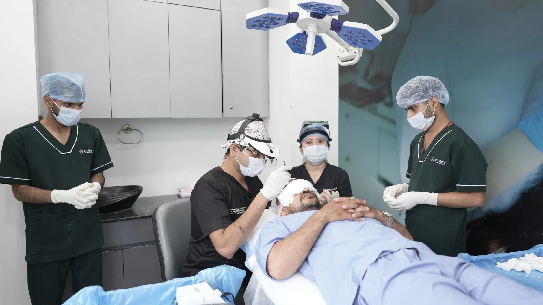 Medical professionals conducting a hair transplant in a clinic setting. at House of Aetheria, Gurugram