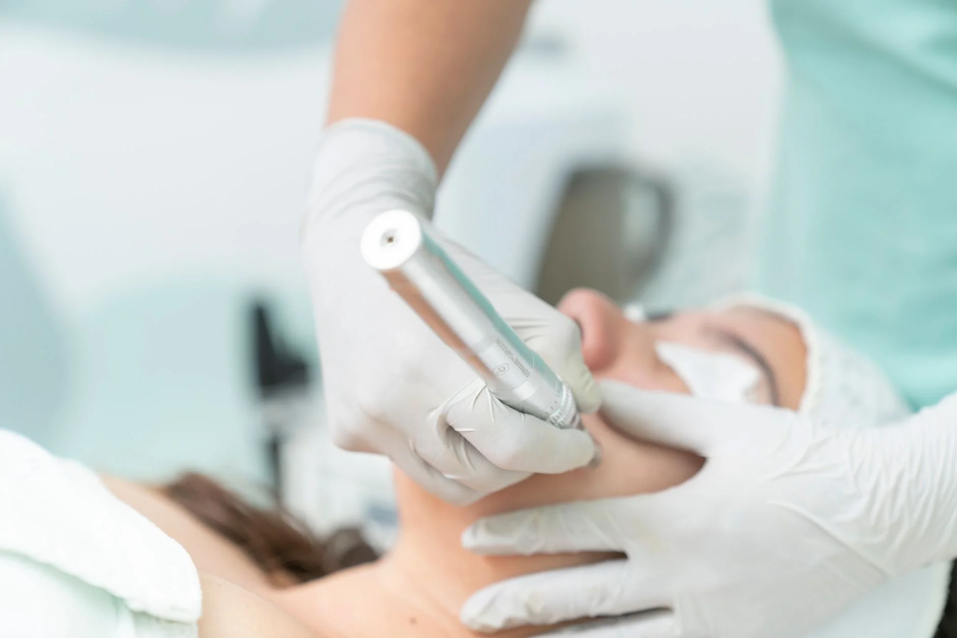 Close-up of a cosmetic treatment being performed in a clinical environment. at House of Aetheria, Gurugram