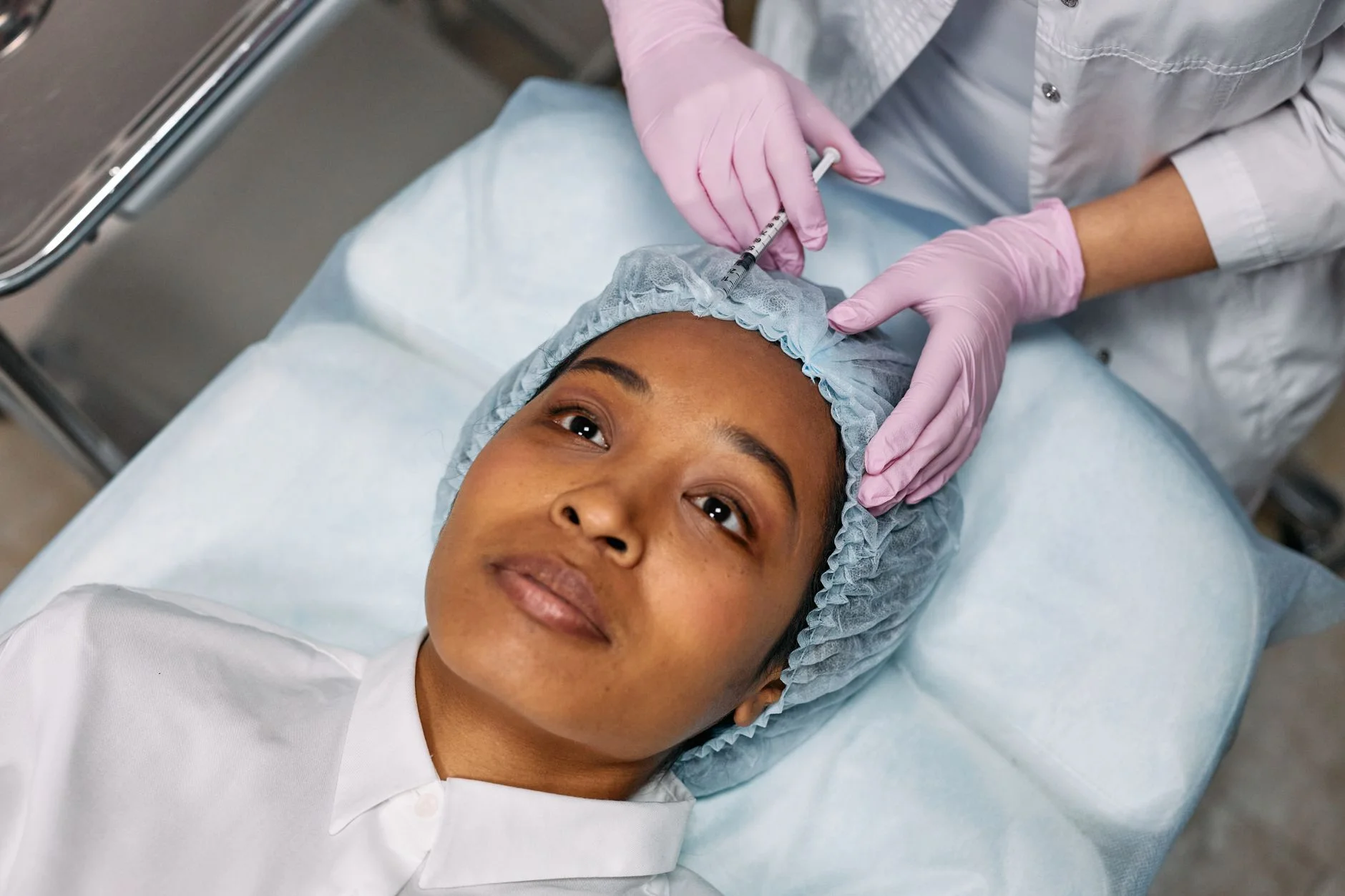 Close-up of a woman receiving a botox injection at a clinic, showcasing a cosmetic procedure. at House of Aetheria, Gurugram